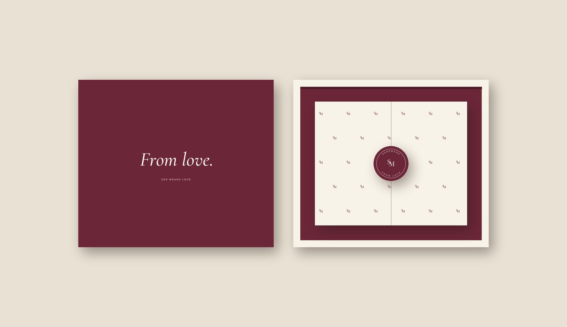 Open ivory mailer box with burgundy inside, the lid printed From love., and tissue sealed with the SM monogram